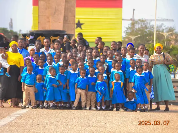 HEWIS pupils and staff posing on an excursion to the coast